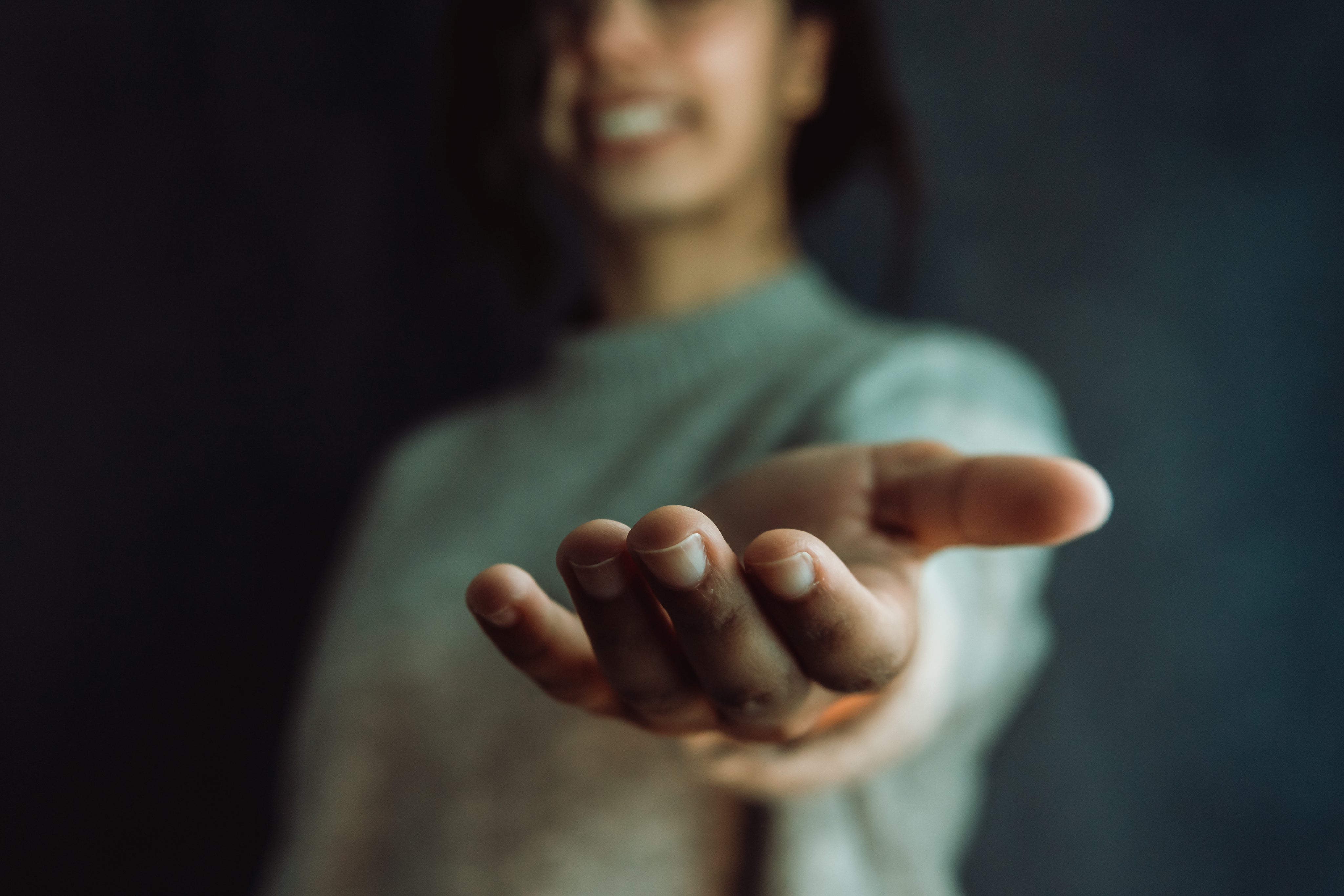 A hand reaching towards the camera